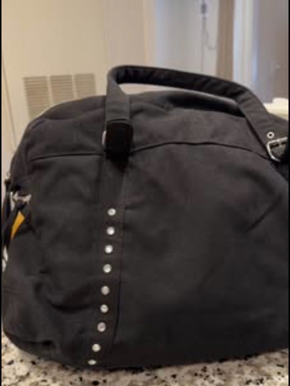 Black Stud-Accent woman’s Travel Duffel Bag